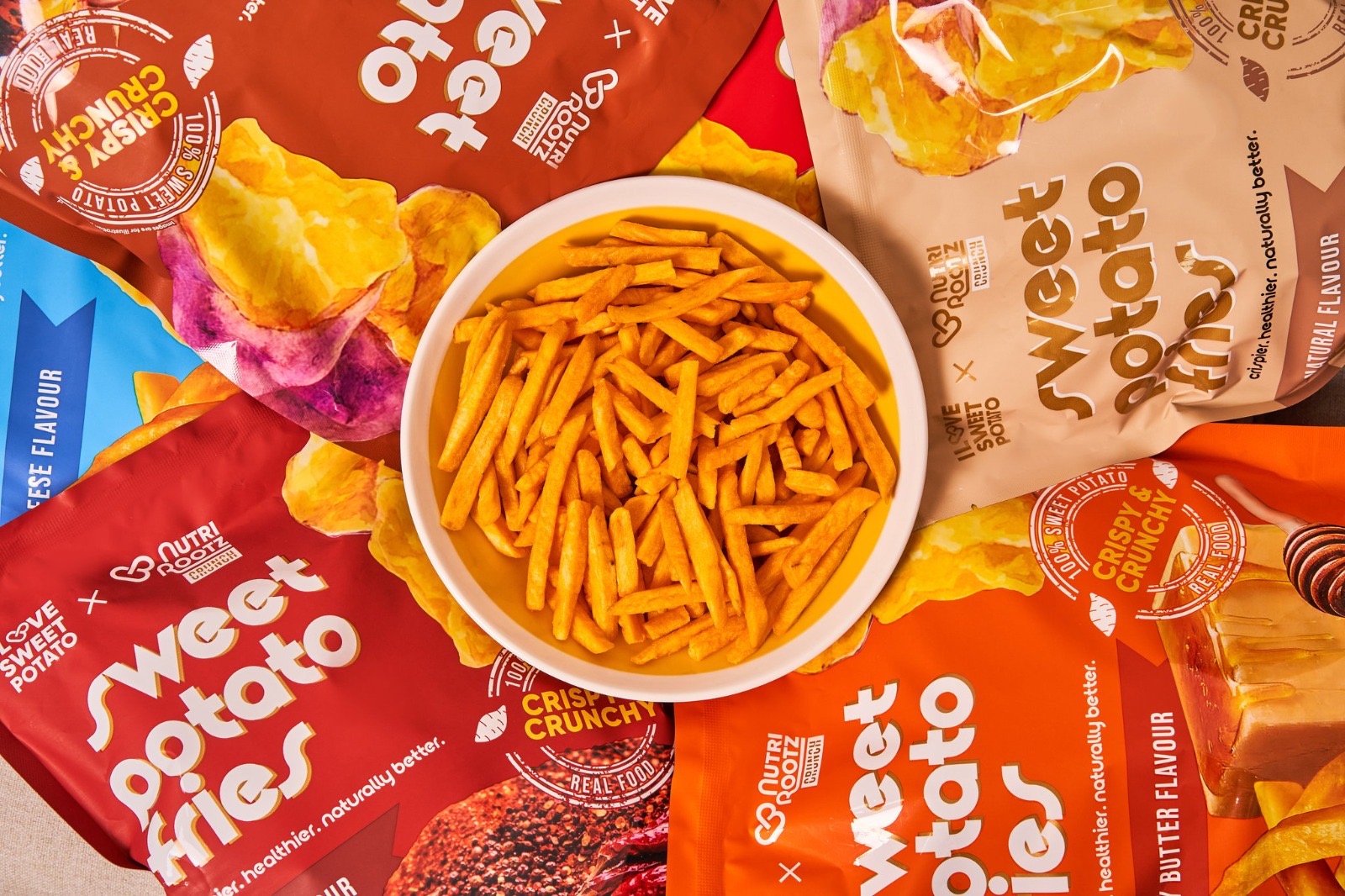 ILSP and NutriRootz snacks in a colourful product arrangement